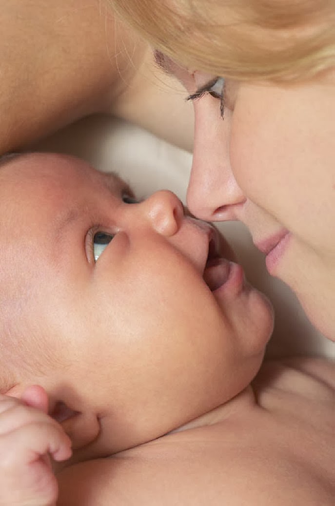 Baby rubs eyes while feeding