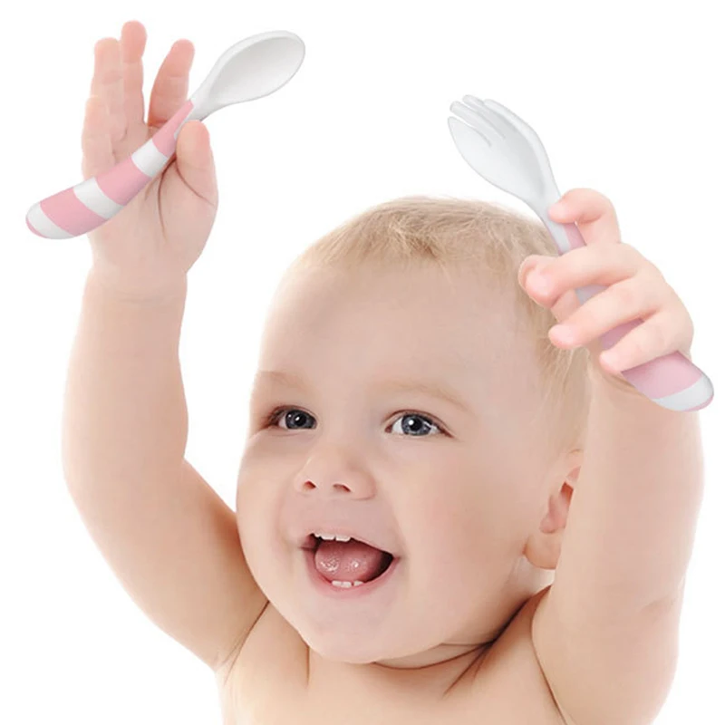 Feeding baby with metal spoon