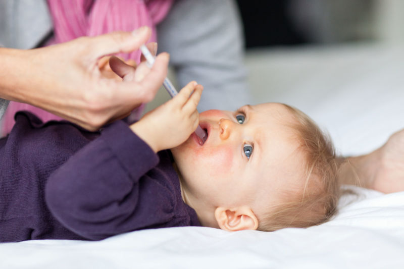 Baby hitting head with hand when feeding