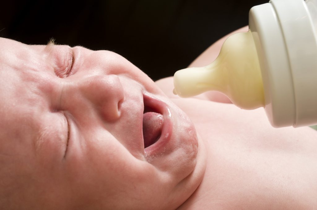 Baby cries during bottle feedings