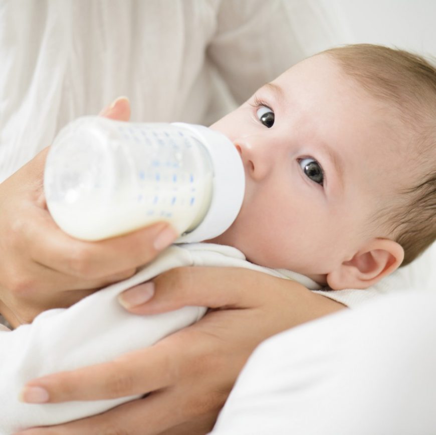 Baby bottle feeding little and often