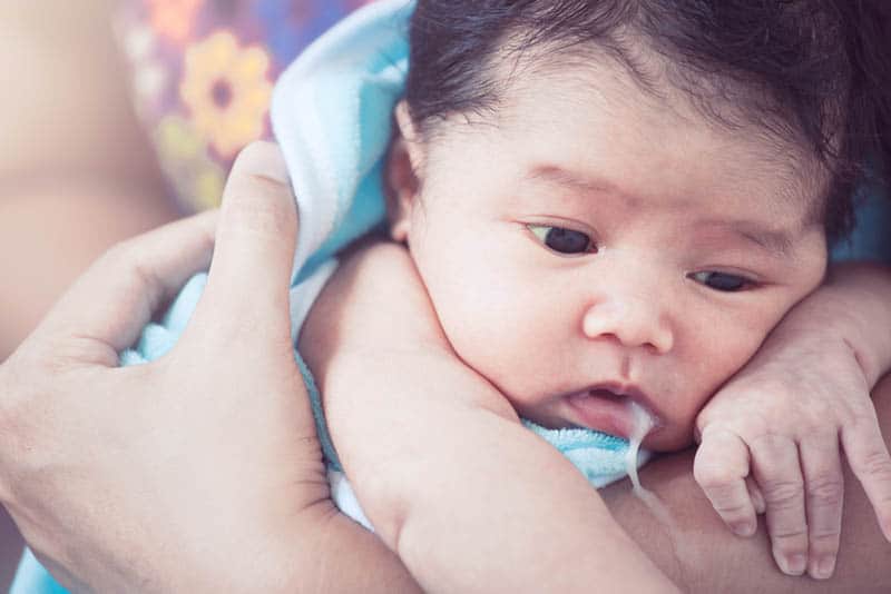 Baby spitting up curdled milk after every feed