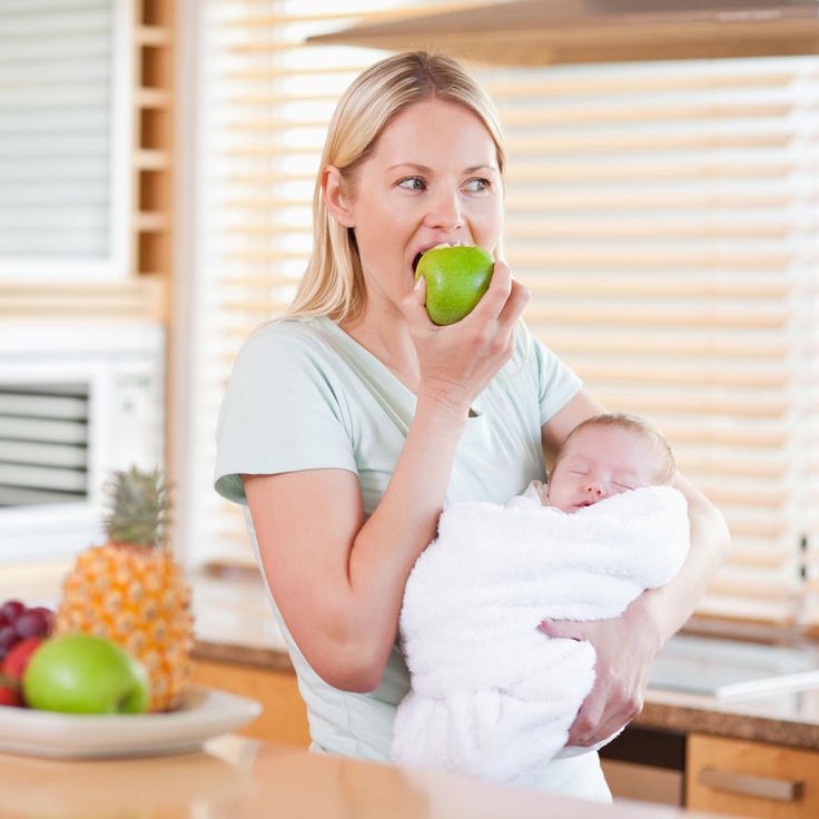 Mother feeds baby