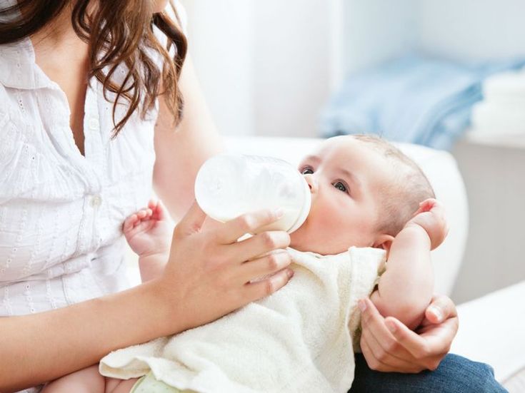 Newborn baby feeding mother milk