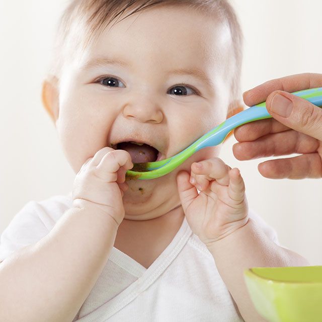 Baby smiling while feeding