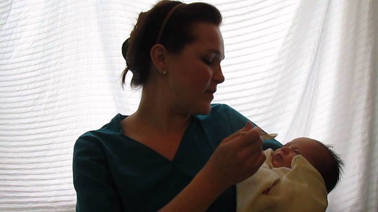 Cup feed newborn baby