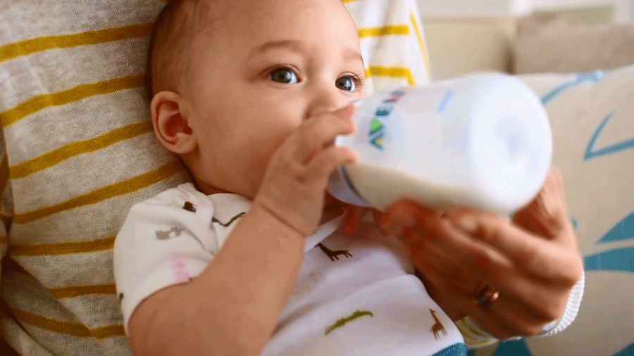 Bottle feeding baby to sleep