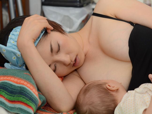 Baby kneading breast while feeding