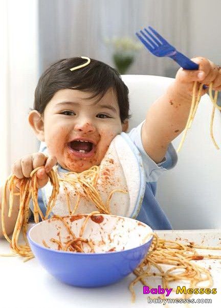 Asian baby eating a breakfast Photograph by Anek Suwannaphoom