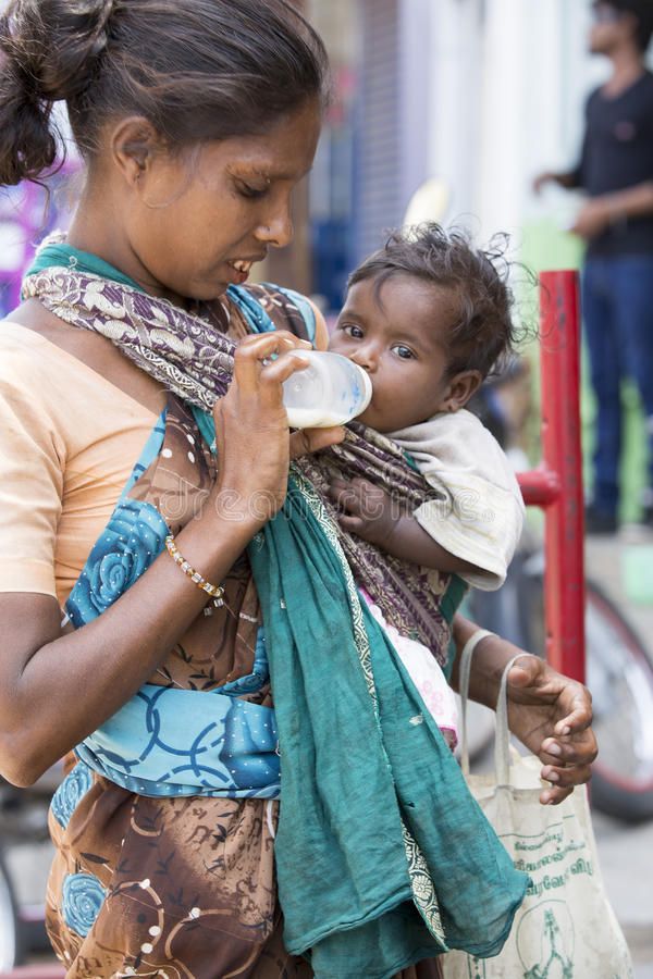 Indian mom feeding baby