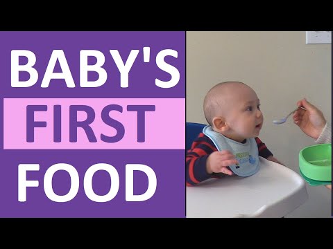 Feeding four month old baby cereal