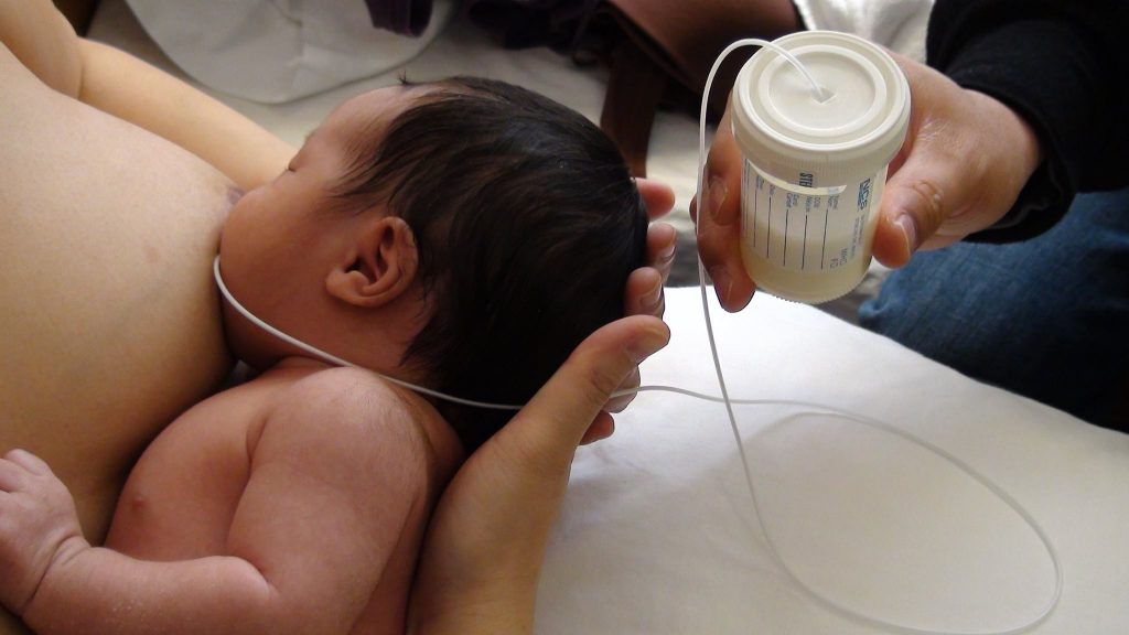 Breastfed baby crying after feeds