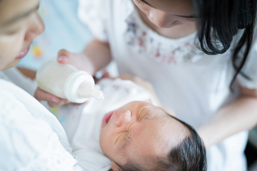 Feeding mother milk to baby