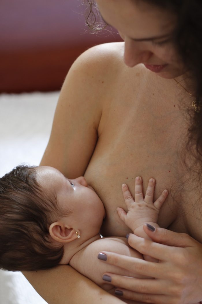 Breastfeeding baby crying while feeding