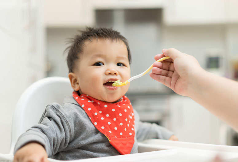 Feeding baby yogurt for the first time